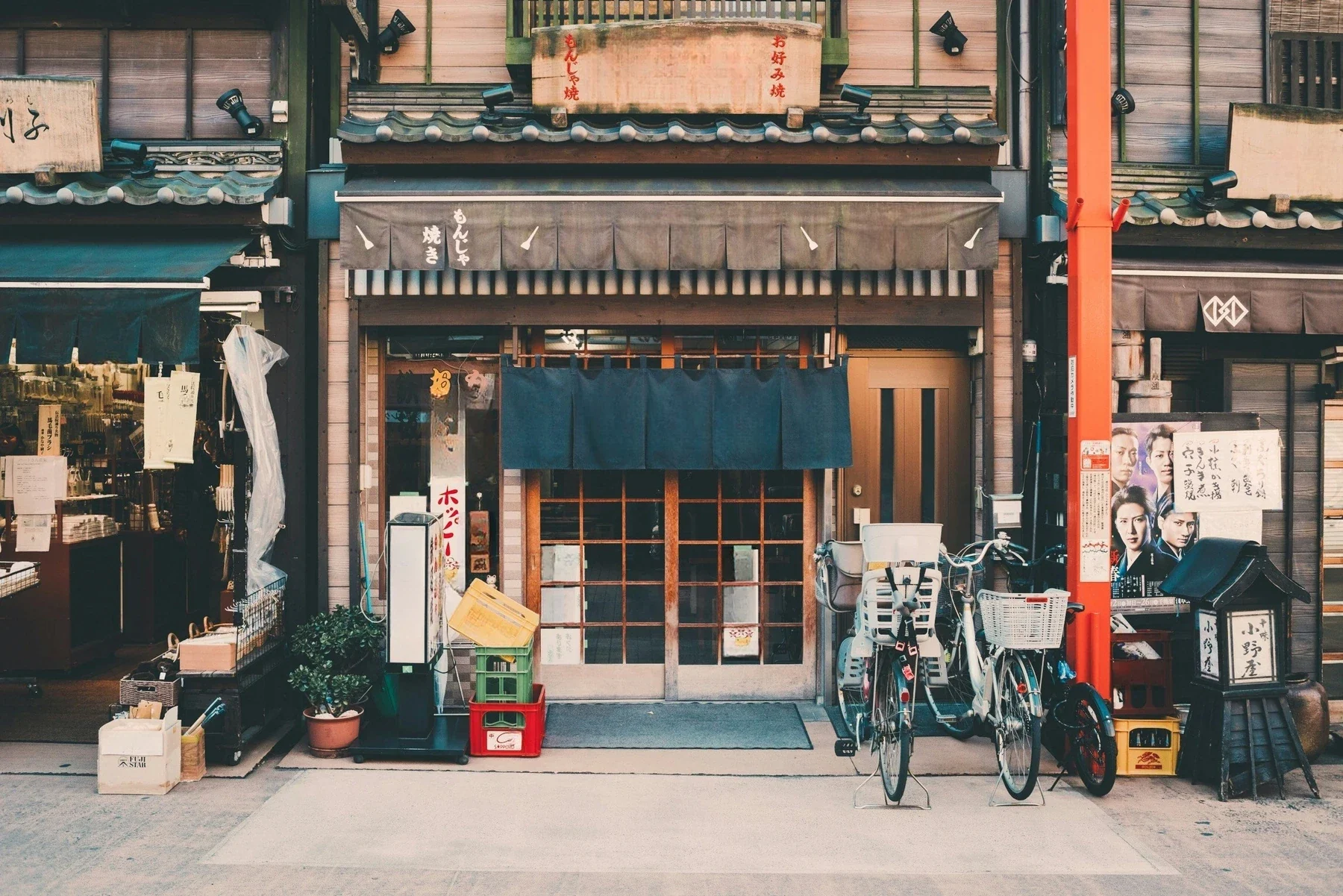 Jasper Remove Text API output for Japanese storefront - shop signage softened across a busy facade