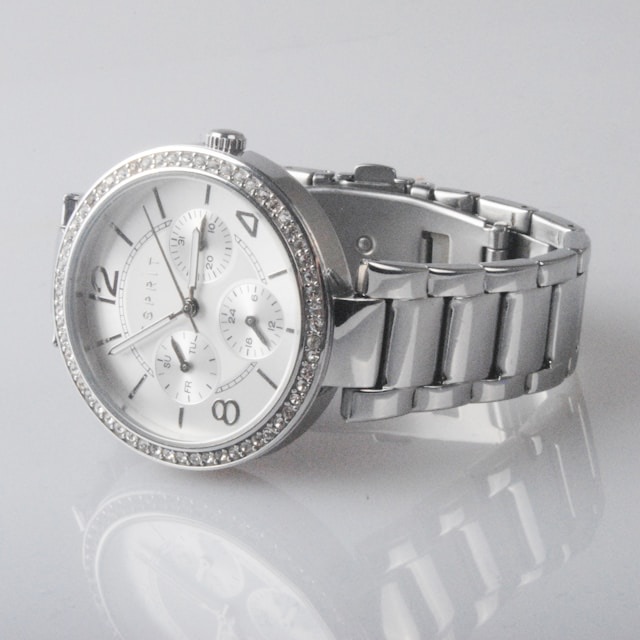 Original June 2026 Upscale benchmark source with a low-contrast watch product image